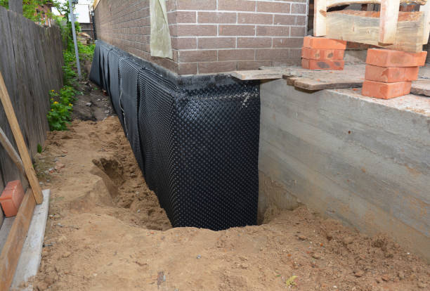 Happy homeowners after waterproofing job in Island Park